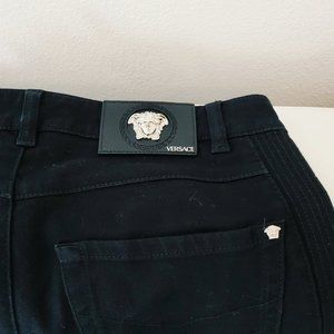 VERSACE black jeans with silver hardware